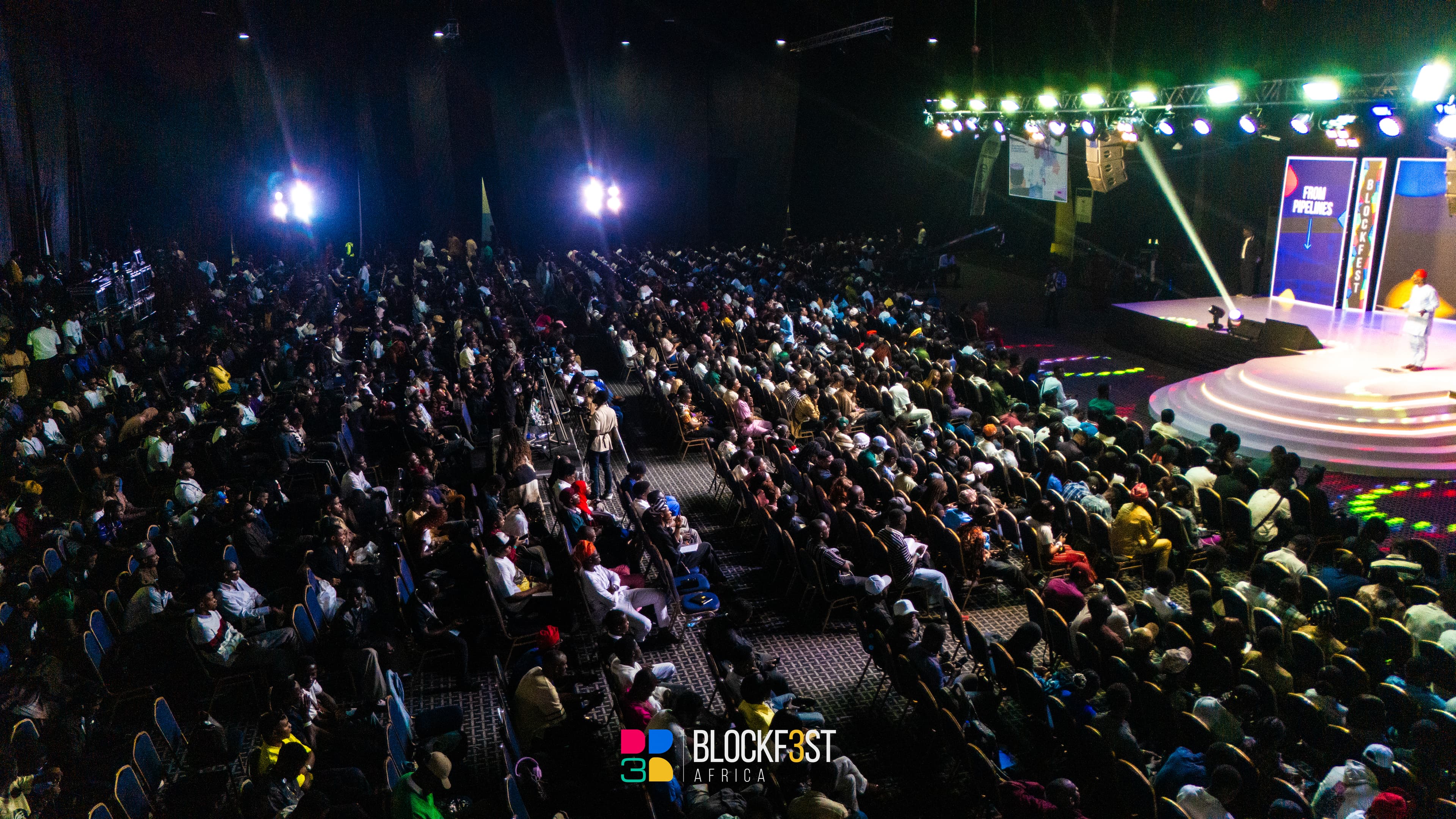 Hall 1/3 aerial shot of audience listening to Dr. Agama Emomotimi, Dir. General of SEC, at Blockfest Africa 2025