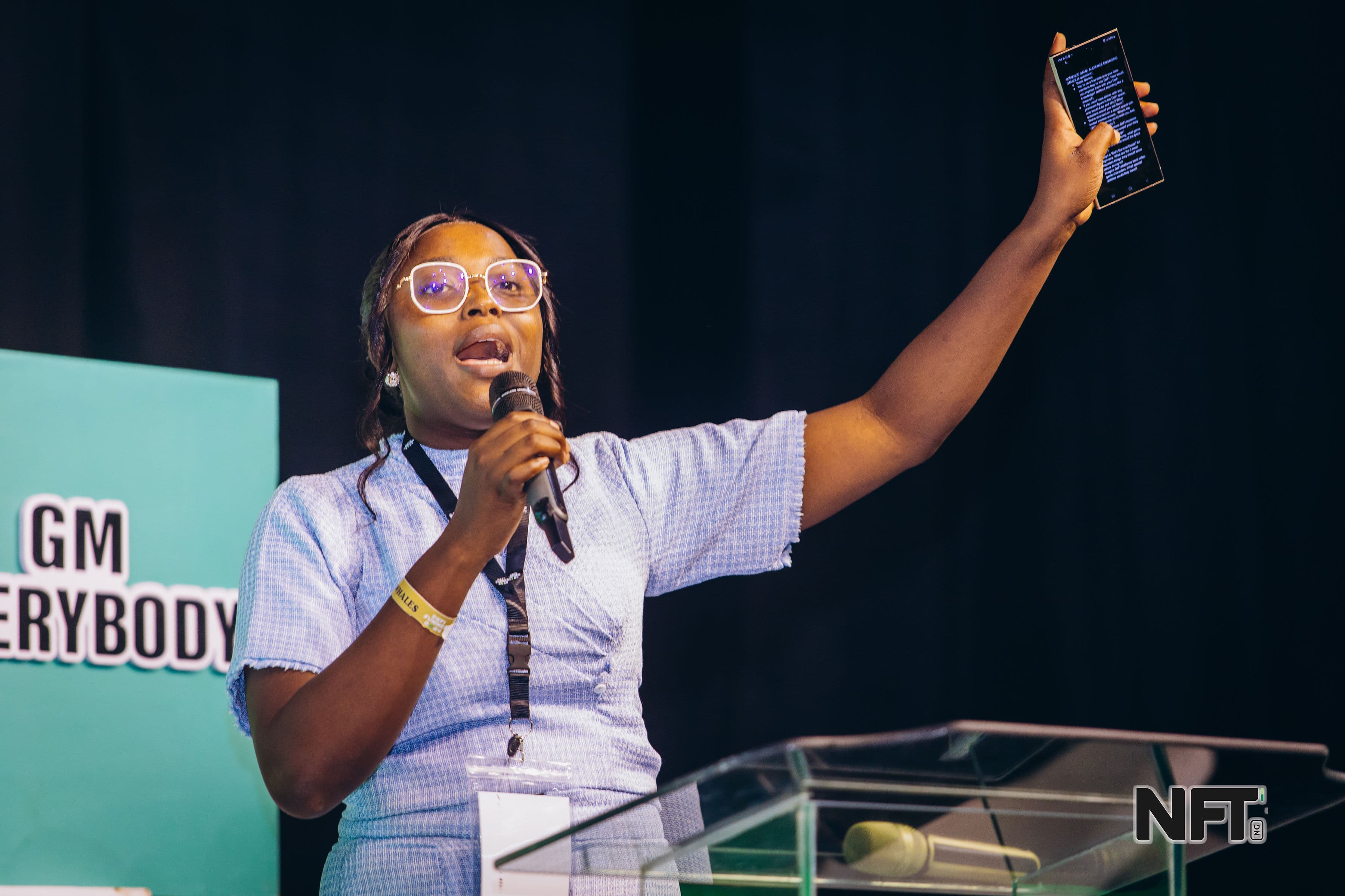 Amahra on stage addressing the audience at DeFi Summer 2024